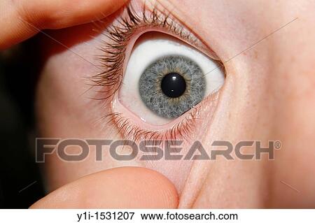 Stock Photo - close up of eye of male teenager. Fotosearch