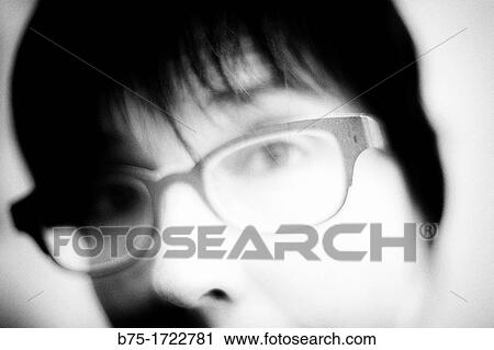 close-up of face of young woman with glasses and looking at the camera, View Large Photo Image Stock Image - close-up of face of young woman with glasses and looking at the camera,. Fotosearch