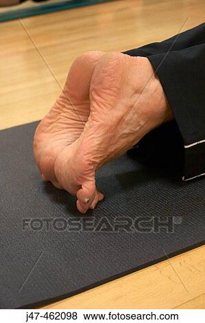 close-up of feet in pilates class stretching on toes View Large Photo Image Stock Photo - close-up of feet in pilates class stretching on toes. Fotosearch
