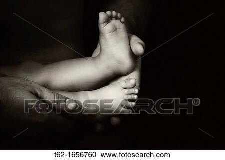 Close up of hands and feet of father and son View Large Photo Image Stock Image - Close up of hands and feet of father and son. Fotosearch