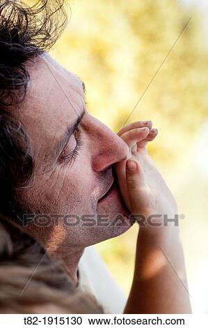 close-up of hands of 6 year old girl stroking the face of his father View Large Photo Image Stock Image - close-up of hands of 6 year old girl stroking the face of his father. Fotosearch