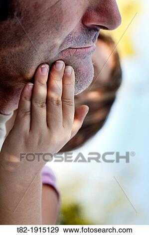 close-up of hands of 6 year old girl stroking the face of his father View Large Photo Image Stock Photo - close-up of hands of 6 year old girl stroking the face of his father. Fotosearch