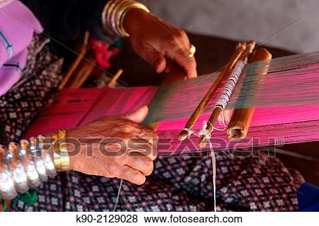 Close-up of hands of a Longneck Karen woman weaving a scarf, Mae Hong Son, Thailand, Southeast Asia. View Large Photo Image Stock Photo - Close-up of hands of a Longneck Karen woman weaving a scarf, Mae Hong Son, Thailand, Southeast Asia.. Fotosearch