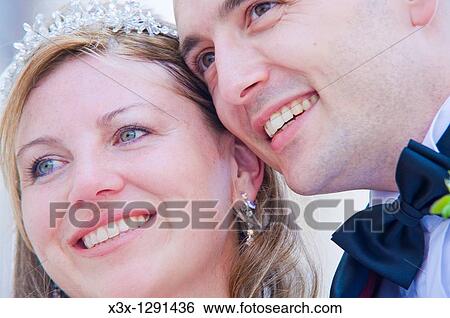 Stock Photograph - Close-up of happy bride and groom. Fotosearch