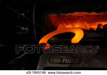 Close-up of Horseshoe in forge View Large Photo Image Stock Photo - Close-up of Horseshoe in forge. Fotosearch