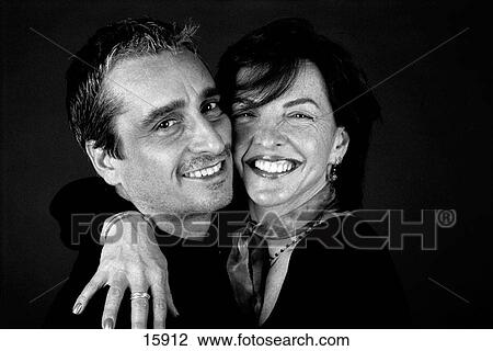 Close-up of hugging attractive middle aged couple View Large Photo Image Stock Image - Close-up of hugging attractive middle aged couple. Fotosearch