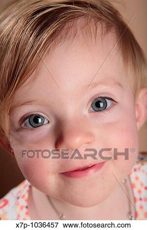 Stock Photo - close up of little girl with big eyes. Fotosearch