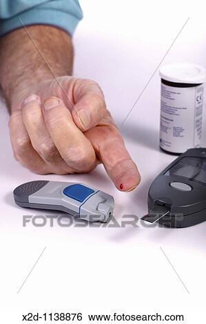 Close-up of male hand while doing a glucose test View Large Photo Image Stock Photograph - Close-up of male hand while doing a glucose test. Fotosearch