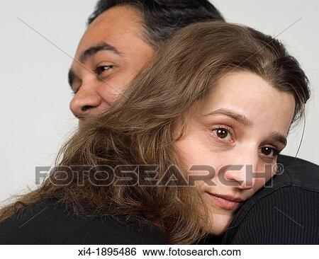 Close-up of mature couple in a hug View Large Photo Image Stock Photograph - Close-up of mature couple in a hug. Fotosearch