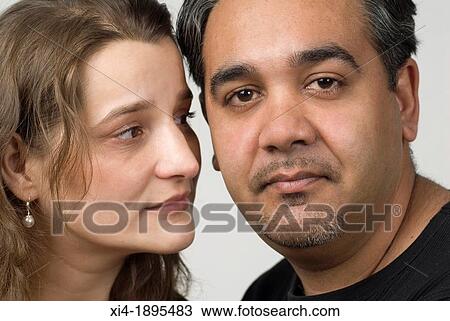 Close-up of mature couple, male is looking into the camera, and female is looking at him View Large Photo Image Stock Image - Close-up of mature couple, male is looking into the camera, and female is looking at him. Fotosearch
