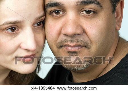 Close-up of mature couple, their faces are touching each other? s View Large Photo Image Picture - Close-up of mature couple, their faces are touching each other? s. Fotosearch