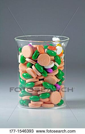 Close-up of pills arranged in a Glass View Large Photo Image Stock Image - Close-up of pills arranged in a Glass. Fotosearch