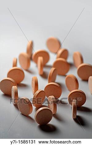 Stock Image - Close-up of pills arranged. Fotosearch