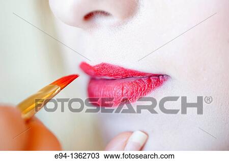 Close up of red lips and mouth of a young woman View Large Photo Image Stock Image - Close up of red lips and mouth of a young woman. Fotosearch