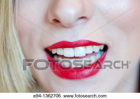Close up of red lips and mouth of a young woman View Large Photo Image Stock Photograph - Close up of red lips and mouth of a young woman. Fotosearch