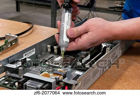 Close up of technician assembling server for computer IT company for shipment or repair. View Large Photo Image Picture - Close up of technician assembling server for computer IT company for shipment or repair.. Fotosearch