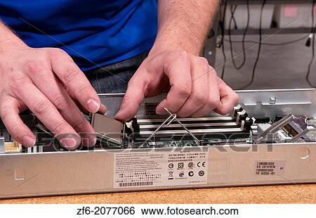 Close up of technician assembling server for computer IT company for shipment or repair. View Large Photo Image Stock Photograph - Close up of technician assembling server for computer IT company for shipment or repair.. Fotosearch