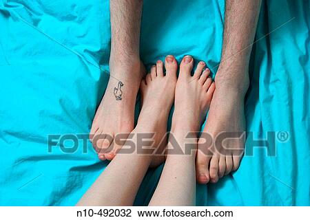 Close-up of teen boy's and teen girl's feet playing together View Large Photo Image Stock Image - Close-up of teen boy's and teen girl's feet playing together. Fotosearch