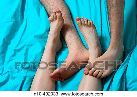 Close-up of teen boy's and teen girl's feet playing together View Large Photo Image Stock Image - Close-up of teen boy's and teen girl's feet playing together. Fotosearch