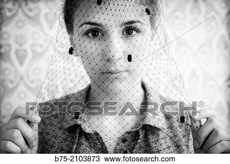 Close-up of teenager girl looking at the camera with a veil in front of her face. View Large Photo Image Stock Image - Close-up of teenager girl looking at the camera with a veil in front of her face.. Fotosearch