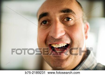 Close-up of the face of a 40-year-old Caucasian man, smiling and with positive attitude. View Large Photo Image Stock Image - Close-up of the face of a 40-year-old Caucasian man, smiling and with positive attitude.. Fotosearch
