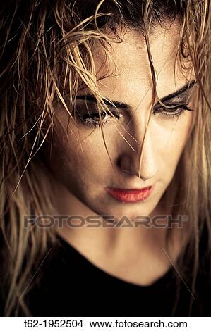 Close up of the face of a young woman with tears in her eyes. View Large Photo Image Picture - Close up of the face of a young woman with tears in her eyes.. Fotosearch