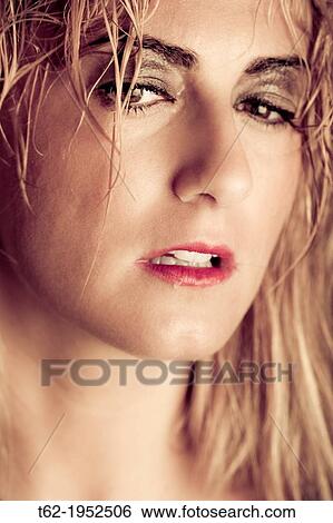 Close up of the face of a young woman with tears in her eyes. View Large Photo Image Stock Photograph - Close up of the face of a young woman with tears in her eyes.. Fotosearch