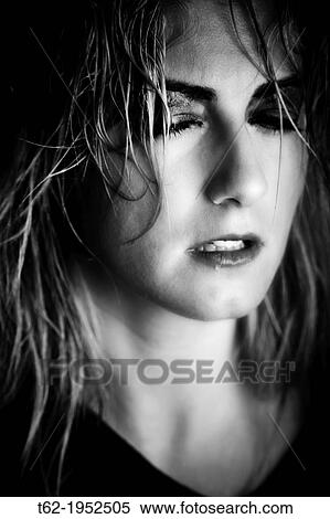 Close up of the face of a young woman with tears in her eyes. View Large Photo Image Stock Photography - Close up of the face of a young woman with tears in her eyes.. Fotosearch
