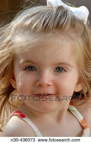 Stock Image - Close-up of Toddler Girl Smiling. Fotosearch