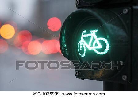 Close-up of traffic light for bicyclists, showing green light at an intersection with blurred background, Hamburg, Germany, Europe View Large Photo Image Stock Photo - Close-up of traffic light for bicyclists, showing green light at an intersection with blurred background, Hamburg, Germany, Europe. Fotosearch