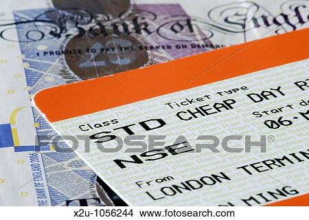 Close-up of UK cheap day return train ticket and banknotes View Large Photo Image Picture - Close-up of UK cheap day return train ticket and banknotes. Fotosearch