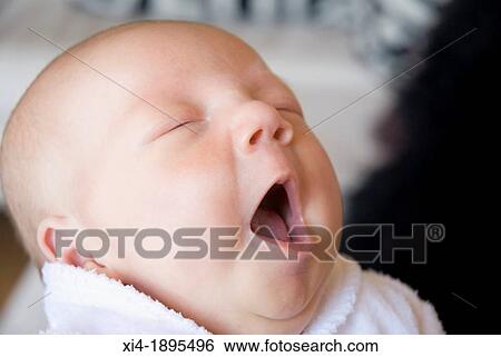 Stock Photograph - Close-up of yawning baby. Fotosearch