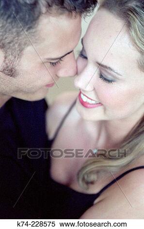 close up of young couple embracing View Large Photo Image Stock Photography - close up of young couple embracing. Fotosearch