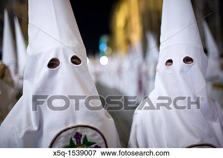 Close up of young hooded penitents, Holy Week, Seville, Spain View Large Photo Image Stock Photo - Close up of young hooded penitents, Holy Week, Seville, Spain. Fotosearch