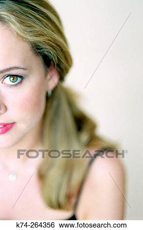 Close-Up of Young Woman Looking at Camera View Large Photo Image Stock Photograph - Close-Up of Young Woman Looking at Camera. Fotosearch