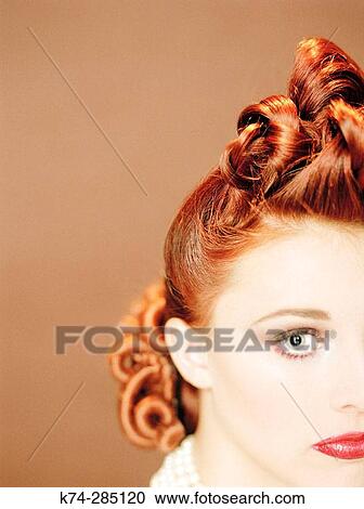 Stock Image - Close-Up of Young Woman With Vintage Hairstyle. Fotosearch