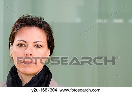 Close up on a self confident woman who watching View Large Photo Image Picture - Close up on a self confident woman who watching. Fotosearch