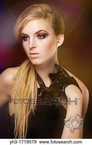 Close up picture of a young woman wearing black dress View Large Photo Image Stock Photo - Close up picture of a young woman wearing black dress. Fotosearch