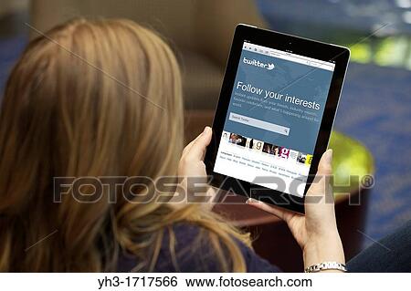 Close up picture of a young woman logging in on Twitter social networking website View Large Photo Image Stock Photograph - Close up picture of a young woman logging in on Twitter social networking website. Fotosearch