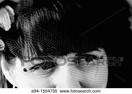 Close-up portrait of a 45 year old brunette with a veil over her eyes View Large Photo Image Stock Photography - Close-up portrait of a 45 year old brunette with a veil over her eyes. Fotosearch