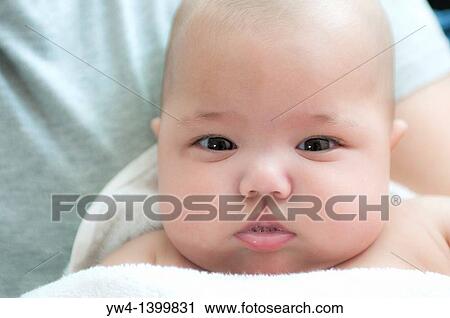 Close up portrait of a baby girl View Large Photo Image Stock Image - Close up portrait of a baby girl. Fotosearch
