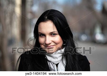 Picture - Close-up portrait of a beautiful 20-25 years women outdoors in the spring. Fotosearch