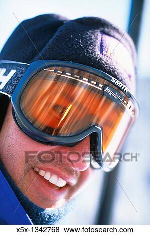 Stock Photo - Close up portrait of a young male skier. Fotosearch