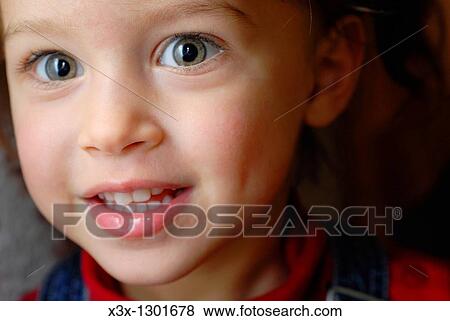 Close up portrait of an enthusiastic little girl View Large Photo Image Stock Photo - Close up portrait of an enthusiastic little girl. Fotosearch