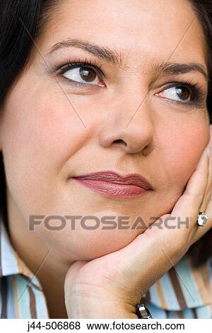 Stock Photo - Close up portrait of woman with hand on face. Fotosearch
