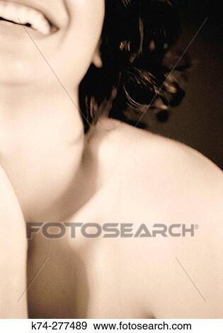 Stock Photo - Close-Up Portrait of Young Woman Laughing. Fotosearch