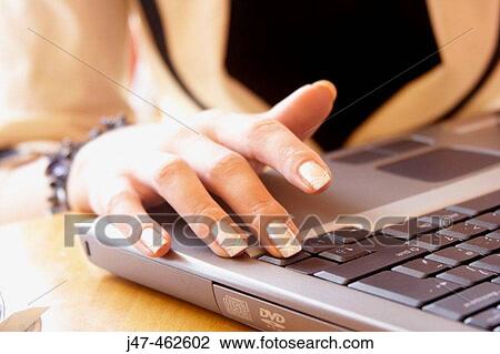 Close up shot of a beautifully manicured hand on a laptop keyboard View Large Photo Image Stock Image - Close up shot of a beautifully manicured hand on a laptop keyboard. Fotosearch