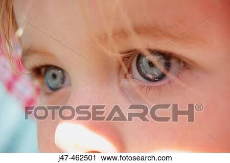 Stock Image - Close-up shot of big blue eyes.. Fotosearch
