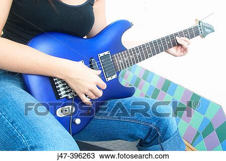 Close up shot of hands on a bright blue electric guitar View Large Photo Image Stock Image - Close up shot of hands on a bright blue electric guitar. Fotosearch