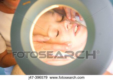 close up shot of woman having a facial through a manifying mirror, at the beauty salon View Large Photo Image Stock Photo - close up shot of woman having a facial through a manifying mirror, at the beauty salon. Fotosearch